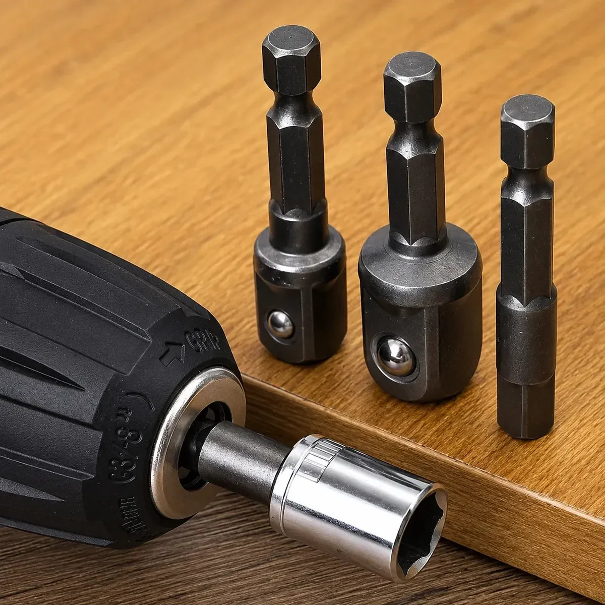 adaptadores y taladro con copa instalada sobre mesa de madera